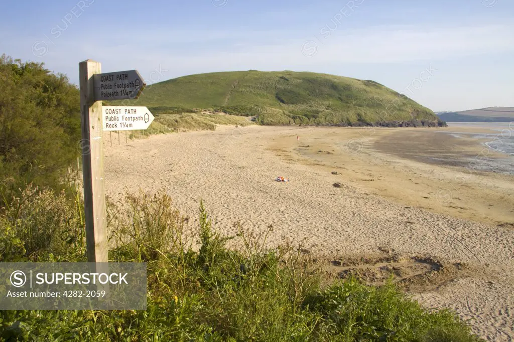 England, Cornwall, near Trebetherick. A coast path directional signpost at Daymer Bay near Trebetherick in north Cornwall.