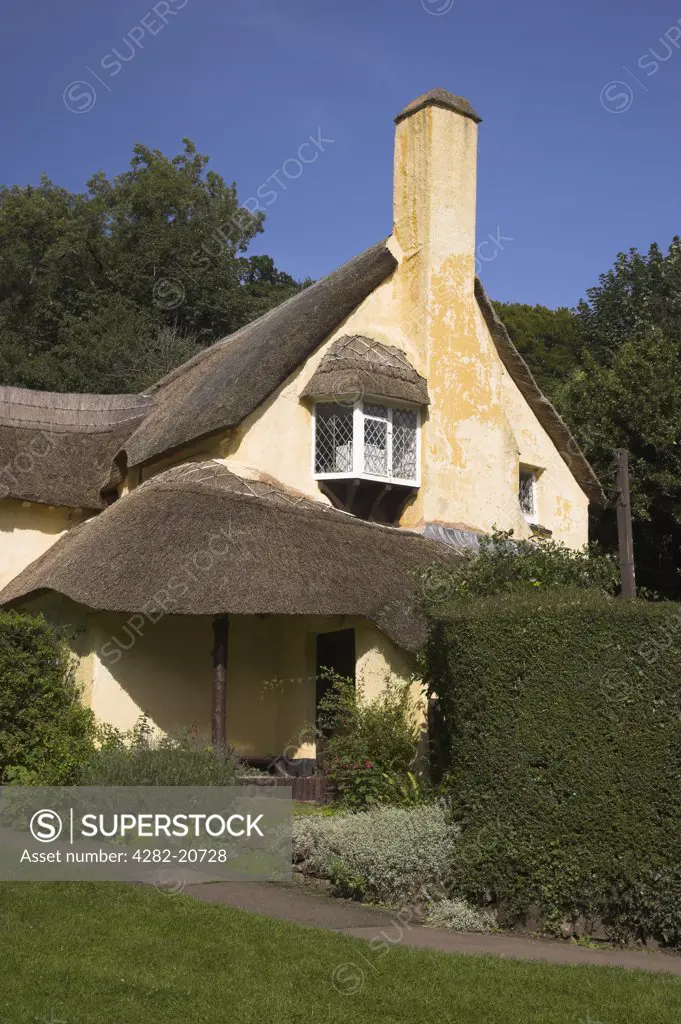 England, Somerset, Selworthy. A thatched cottage in the village of Selworthy within the Exmoor National Park.