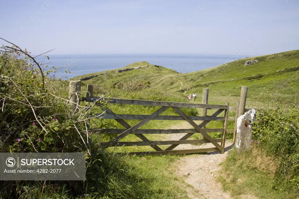 England, Cornwall, Barras Nose. A gate across a footpath leading to Barras Nose in North Cornwall.