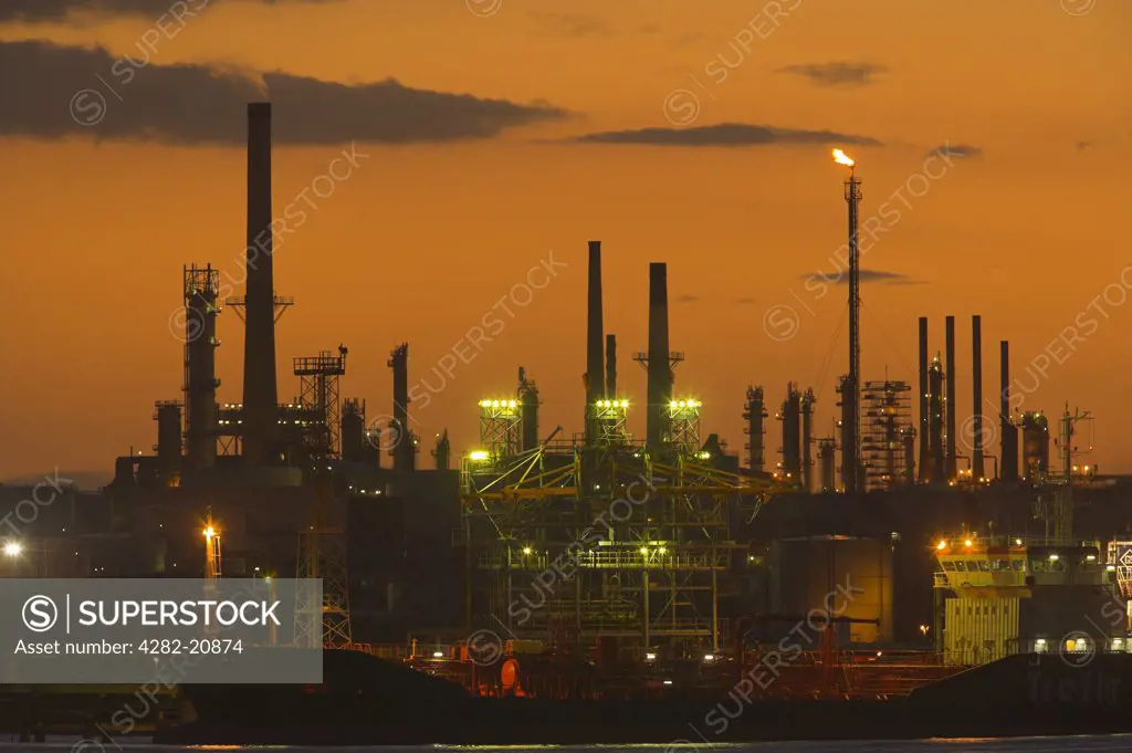 England, Hampshire, Fawley. Fawley oil refinery, the largest facility of its kind in the UK, at sunset.