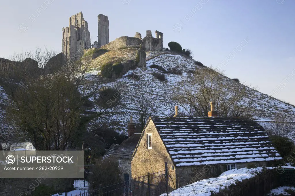 England, Dorset, Corfe Castle. Corfe Castle and village after a Snow Blizzard in March 2009.