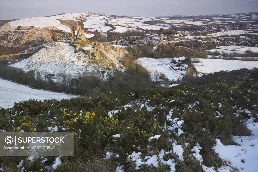 England, Dorset, Corfe Castle. Corfe Castle and village after a Snow Blizzard in March 2009.