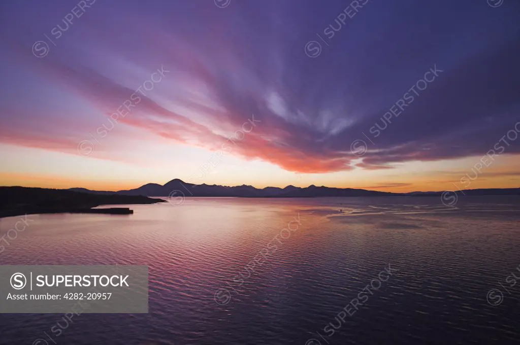 Scotland, Highland, Kyle of Lochalsh. Sunset over the Cuillin Mountains from the Skye Bridge, Kyle of Lochalsh.