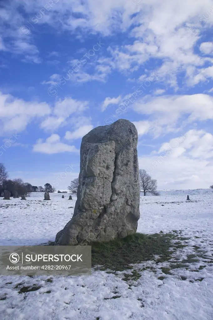 England, Wiltshire, Avebury. Avebury with snow on the ground on a winter morning. Avebury is the largest stone circle in the world, it is 427m in diameter and covers an area of 28 acres.