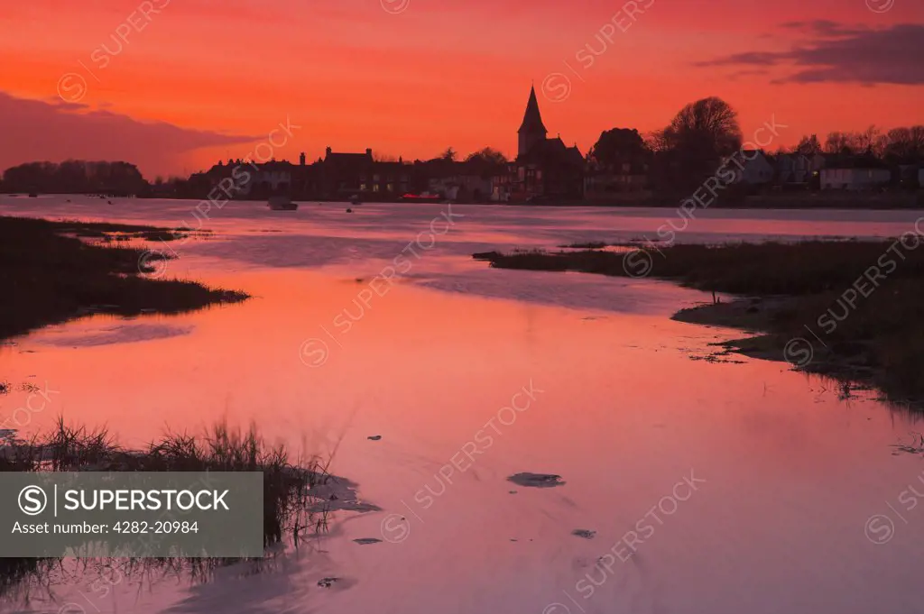 England, West Sussex, Bosham. Dramatic sunset at Bosham near Chichester. Bosham is thought by many to be the birth and burial place of the last Saxon King, Harold, King of England & Earl of Wessex.