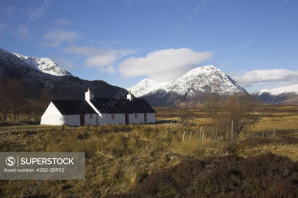 Scotland, Highland, Glencoe. Blackrock Cottage and Buachaille Etive Mor at the head of Glen Etive.