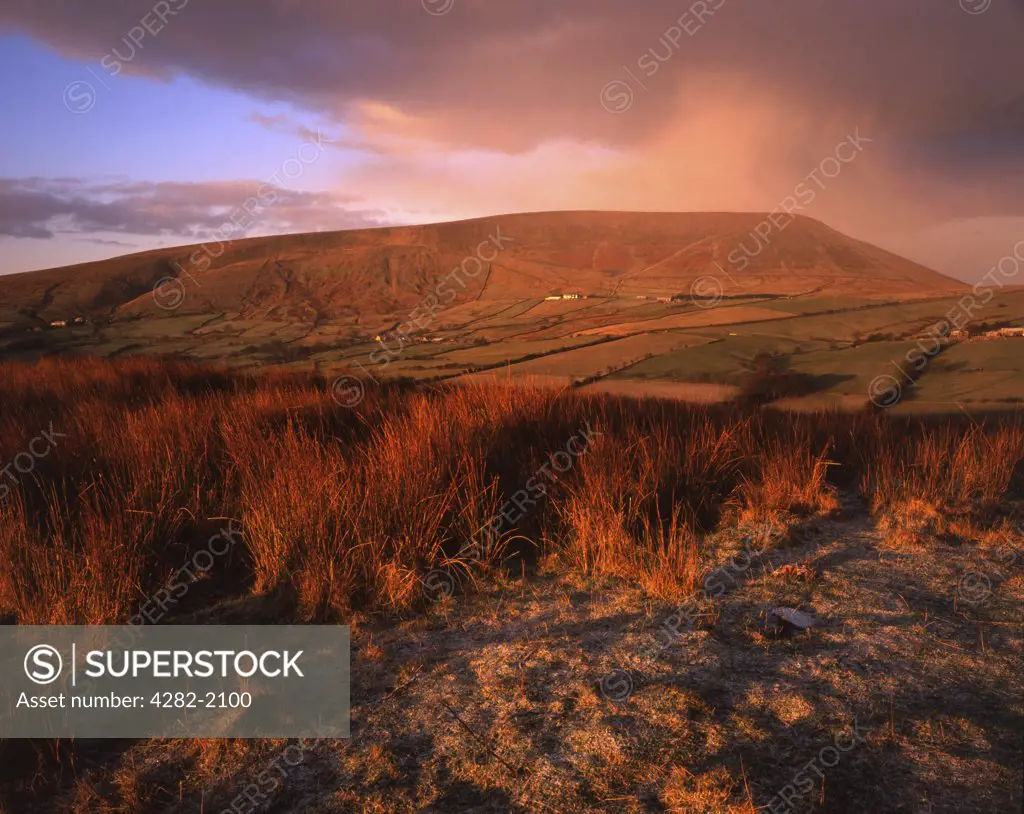 England, Lancashire, Pendle Hill. A brief snow shower brushes the summit of Pendle Hill. The hill is associated with witchcraft and every Halloween attracts large numbers of visitors.