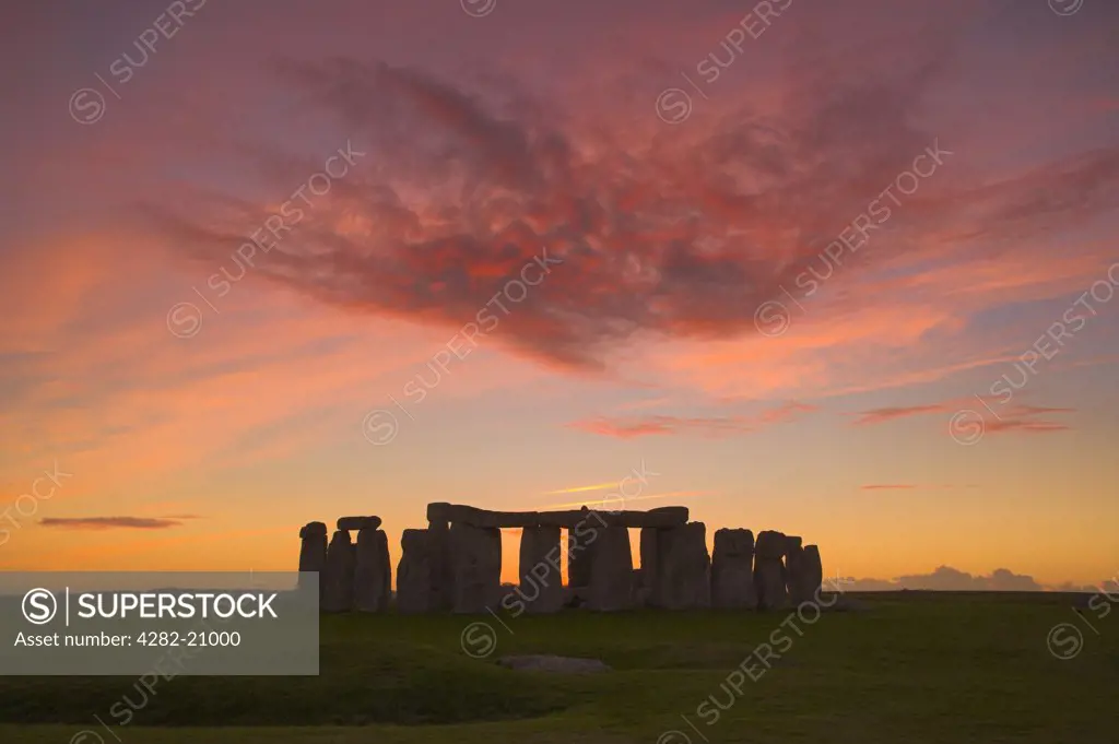 England, Wiltshire, Stonehenge. Sunset over Stonehenge, a prehistoric monument of large standing stones at the centre of a World Heritage Site. Stonehenge is one of the most famous and mysterious sites in the world.