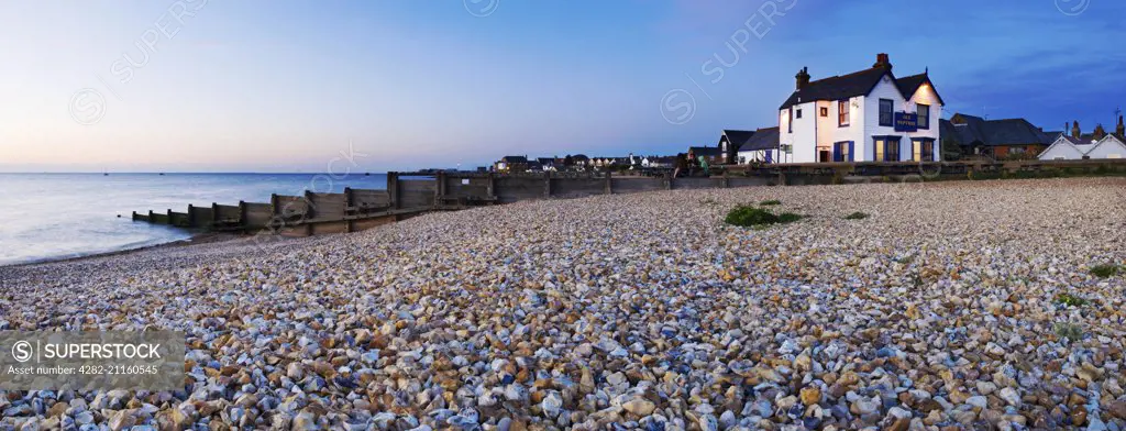 A view of the Neptune pub on the shingle beach at Whitstable.