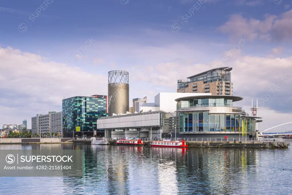 Salford Quays theatre seen across the north bay of the basin.