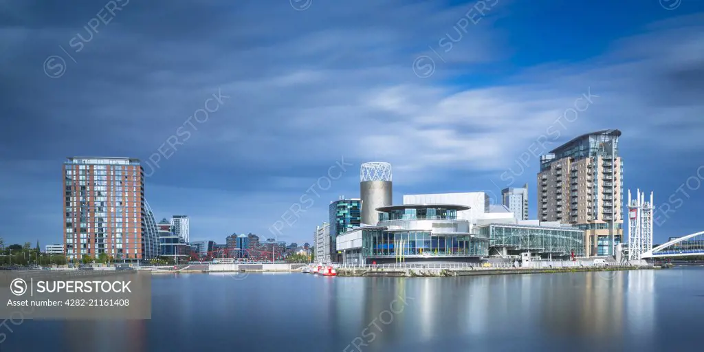 Salford Quays theatre seen across the north bay of the basin.