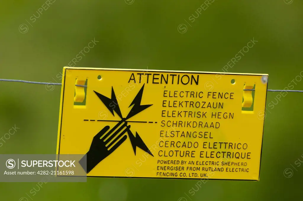 Warning sign on electric fence.