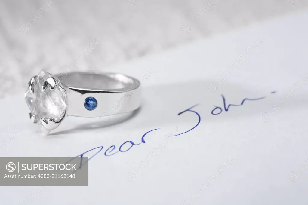 Returned engagement ring and a Dear John letter.