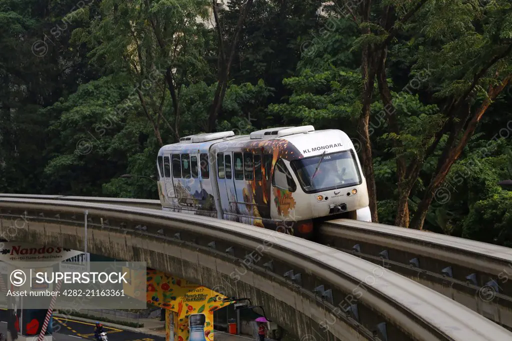 Monorail train travels along the track in central Kuala Lumpur.
