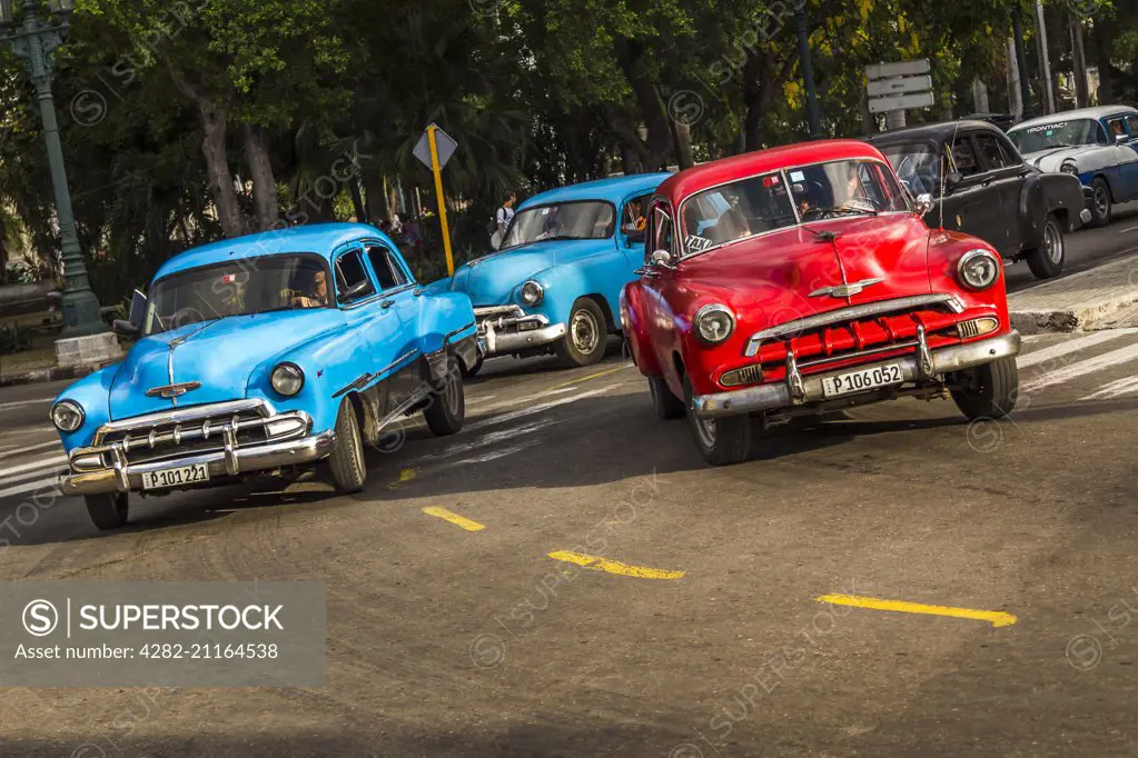 Classical cars at dusk in Havana.