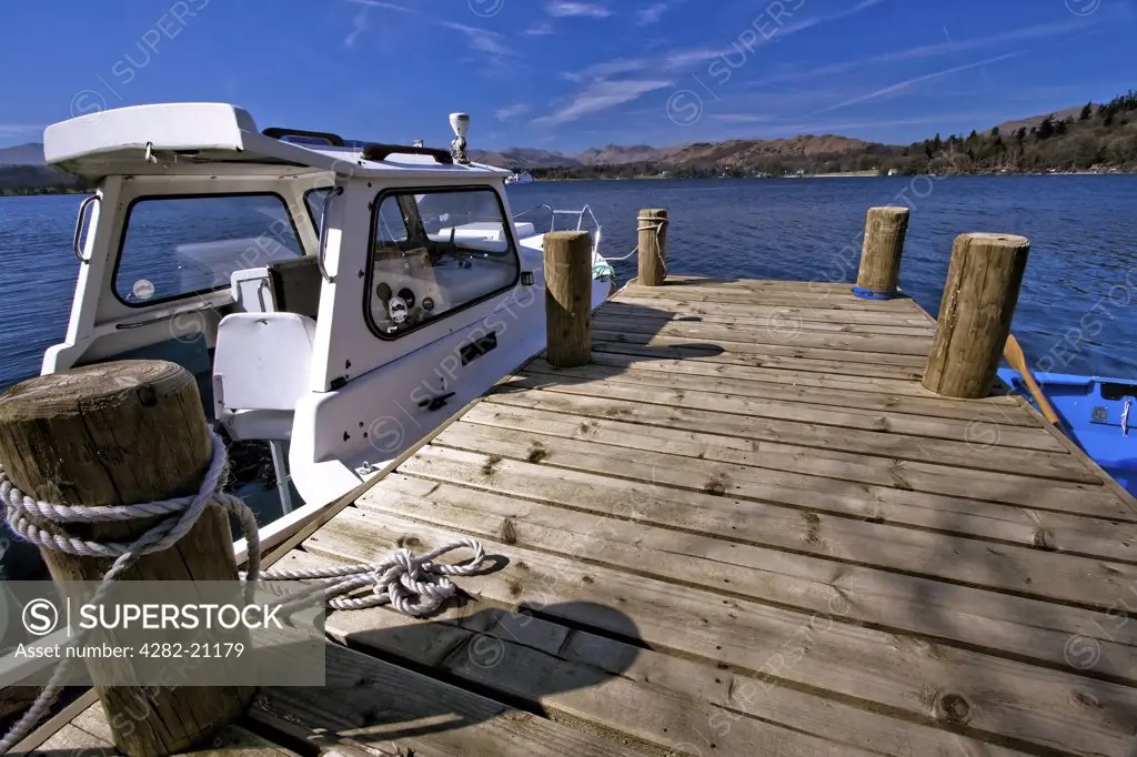 England, Cumbria, Windemere. Boats moored on a jetty at Lake Windemere.
