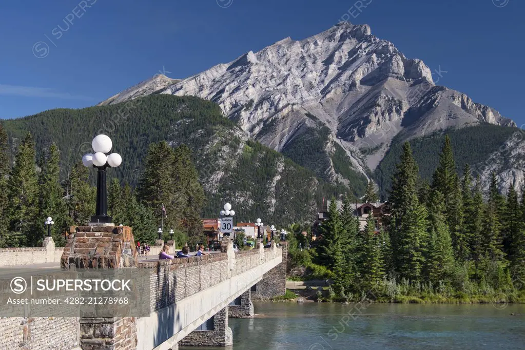 Bow River Bridge with Bow River and Cascade Mountain in Banff in the Canadian Rockies.