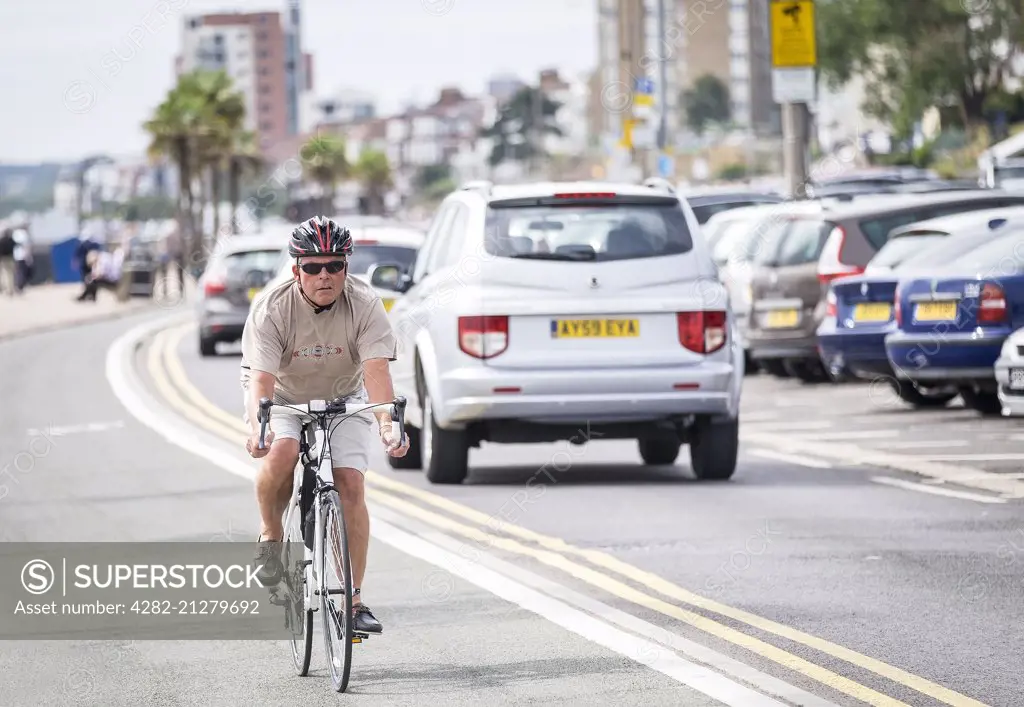 A cyclist using the cycle lane on Southend seafront in Essex.