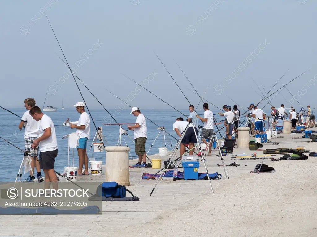 Fishing on the waterfront at Zadar in Croatia.