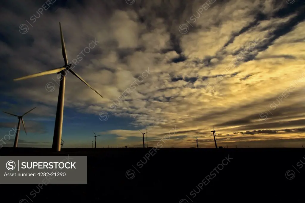 England, East Yorkshire, Withernsea. Dusk skies above the turbines at Withernsea Windfarm in East Yorkshire.
