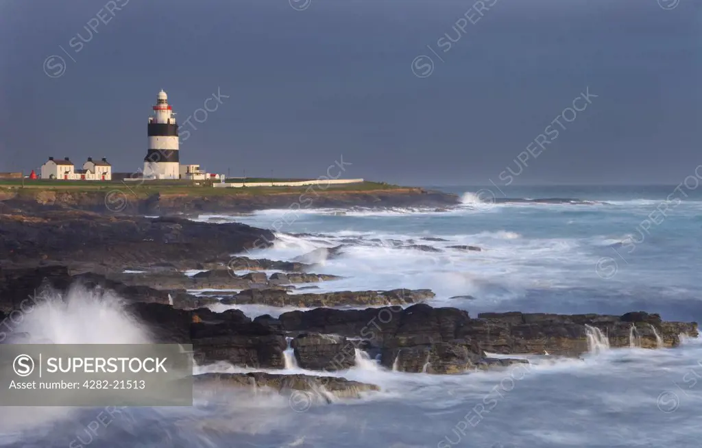 Ireland, County Wexford, Hook Head. A view toward Hook Lighthouse. It was built in the thirteenth century as a navigation aid by William Marshall, Earl of Pembroke and is one of the oldest lighthouses in the world.