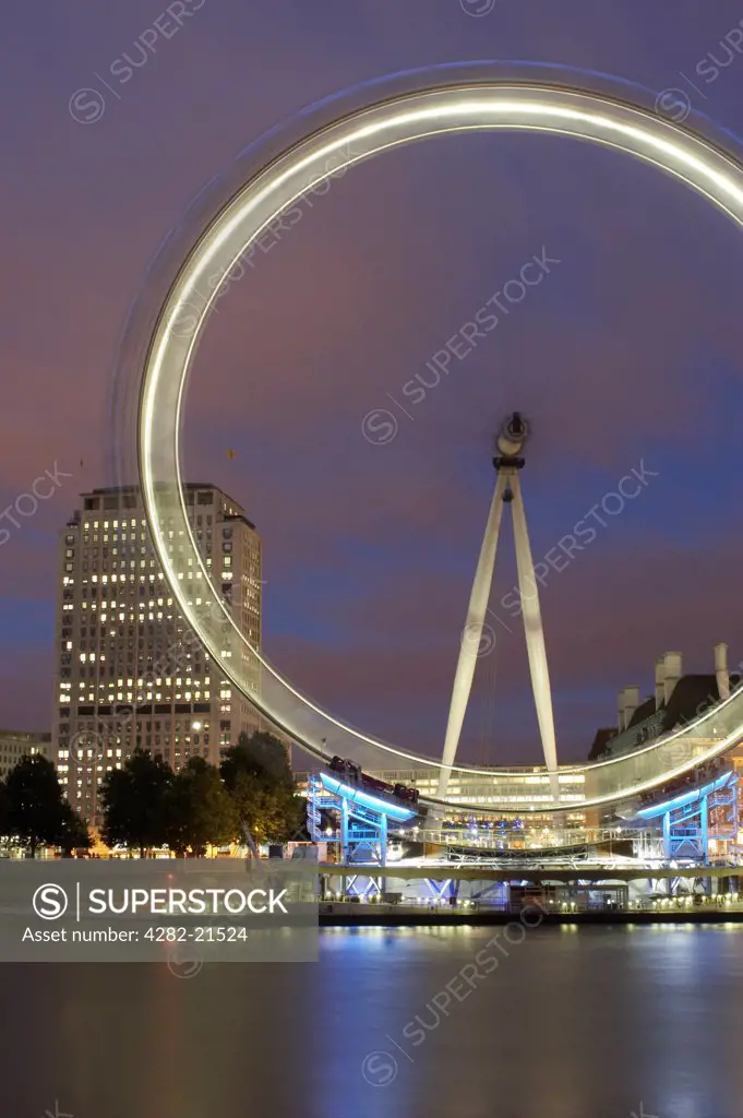 England, London, South Bank. London Eye at Night. The British Airways London Eye is the world's tallest observation wheel at 135m high.