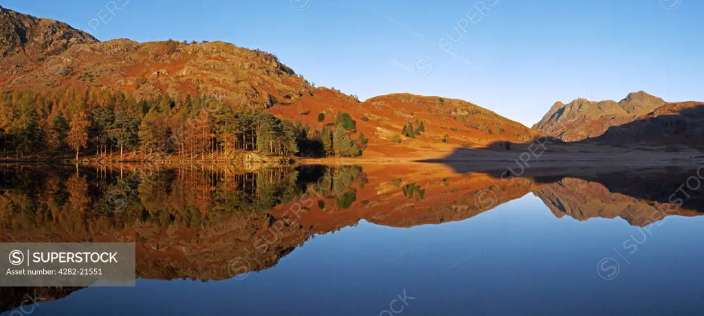 England, Cumbria, Blea Tarn. Reflections in Blea Tarn at sunrise.