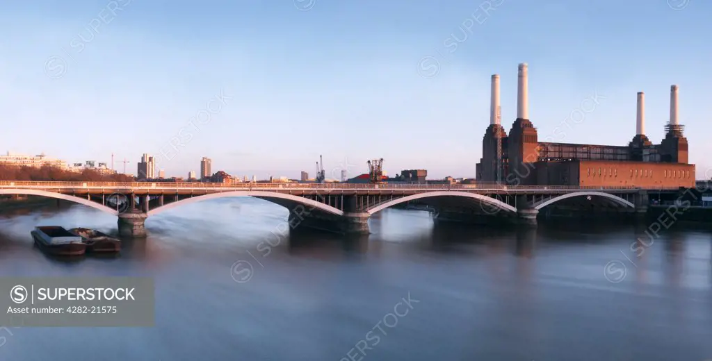 England, London, Battersea. Battersea Power Station Panoramic with railway crossing.
