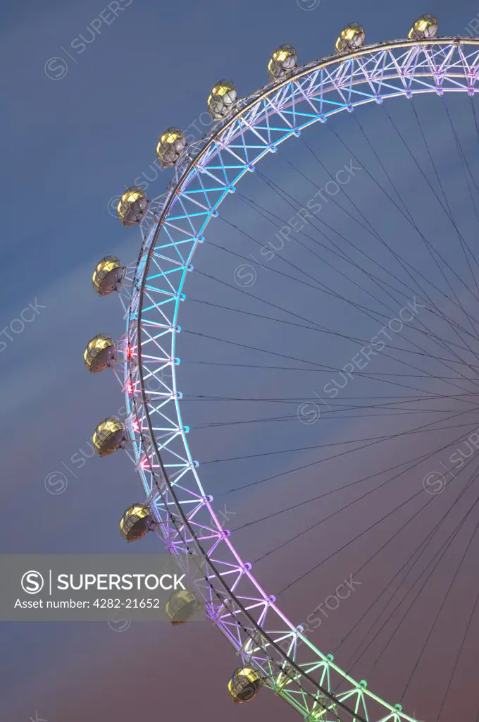 England, London, London Eye. The London Eye in Gay Pride lighting. The London Eye can carry 800 passengers per revolution - equivalent to 11 London red doubled-decker buses.