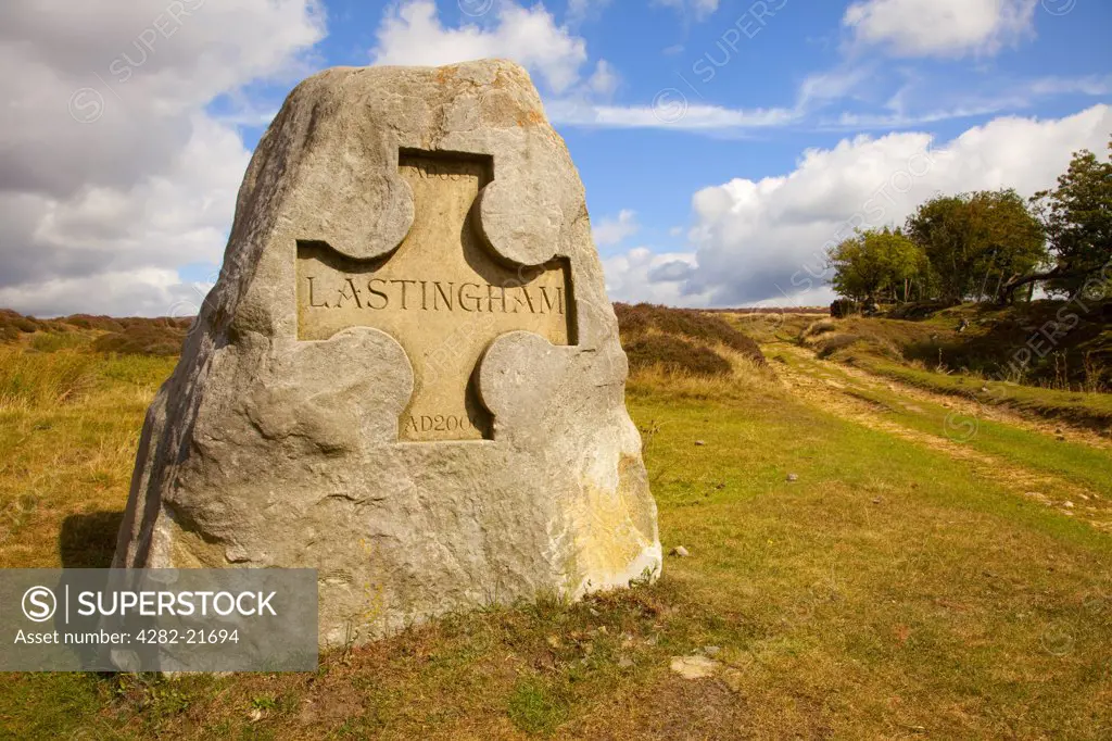 England, North Yorkshire, Lastingham. Stone sign on the footpath above Lastingham in the North Yorkshire Moors.