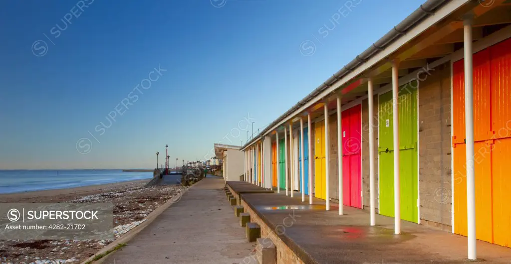 England, East Riding of Yorkshire, Bridlington. Colourful beach huts on Bridlington's North Beach.