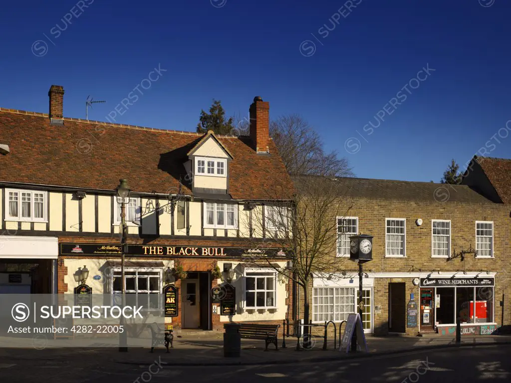 England, Hertfordshire, Buntingford. A view of the town centre with pub, dentists and wine merchants.