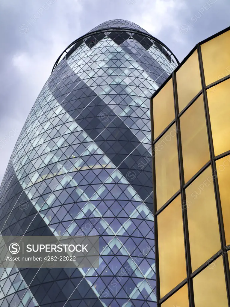 England, London, City of London. Looking up at the Swiss Re building in the City of London financial district.
