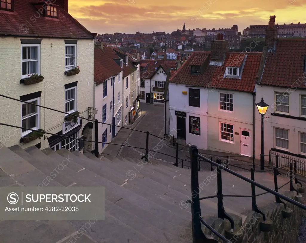 England, North Yorkshire, Whitby. A view down the Church Steps at sunset.