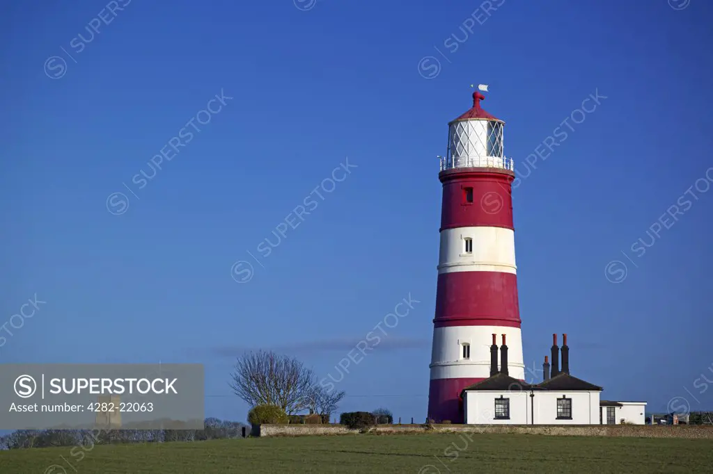 England, Norfolk, Happisburgh. A view toward Happisburgh Lighthouse. It is the oldest working light in East Anglia and the only independently run lighthouse in Great Britain.