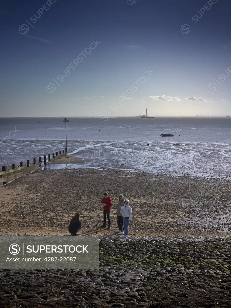 England, Essex, Southend-on-Sea. Youths on the seafront at Southend in Winter.