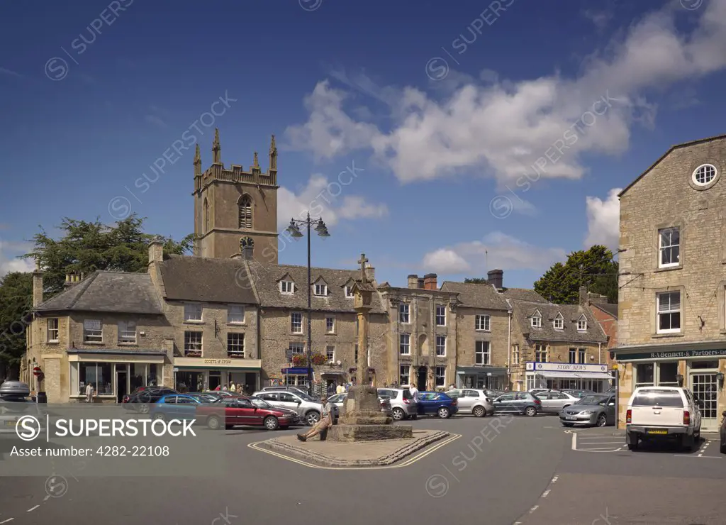 England, Gloucestershire, Stow-on-the-Wold. The church tower and sandstone buildings of Stow on the Wold in the Cotswolds.
