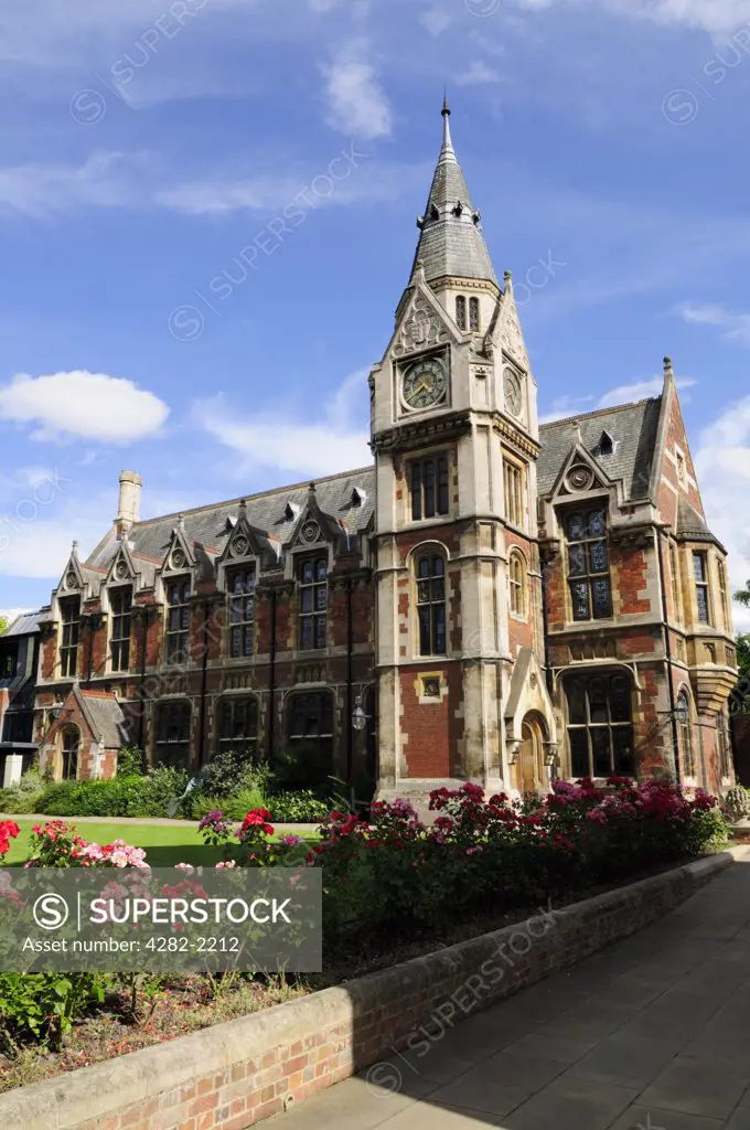 England, Cambridgeshire, Cambridge. The College Library and clock tower at Pembroke College, designed by Alfred Waterhouse and completed in 1879.