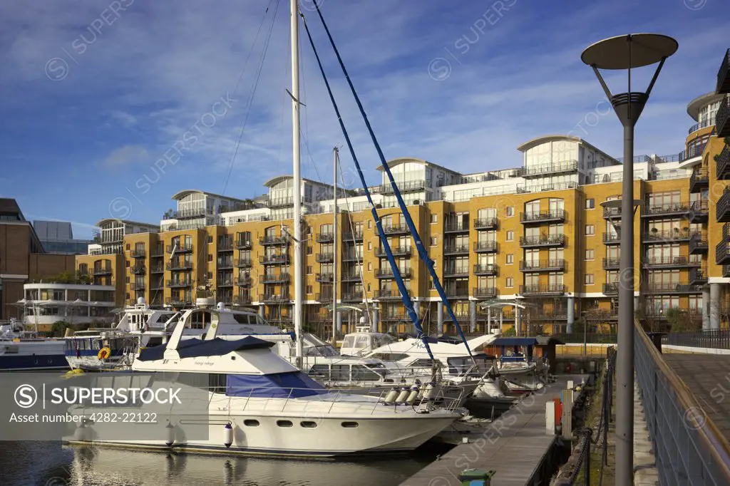 England, London, City Quays. The City Quays residential development in St Katharine Dock with boats at the quayside.