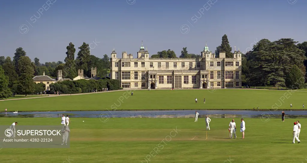 England, Essex, Saffron Walden. A cricket match played in front of Audley End house.