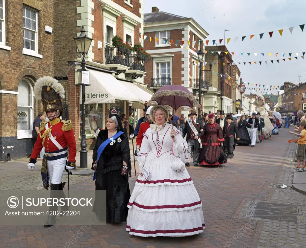 England, Kent, Rochester. People parading through Rochester in Victorian costumes at the Dickens Festival 2010.