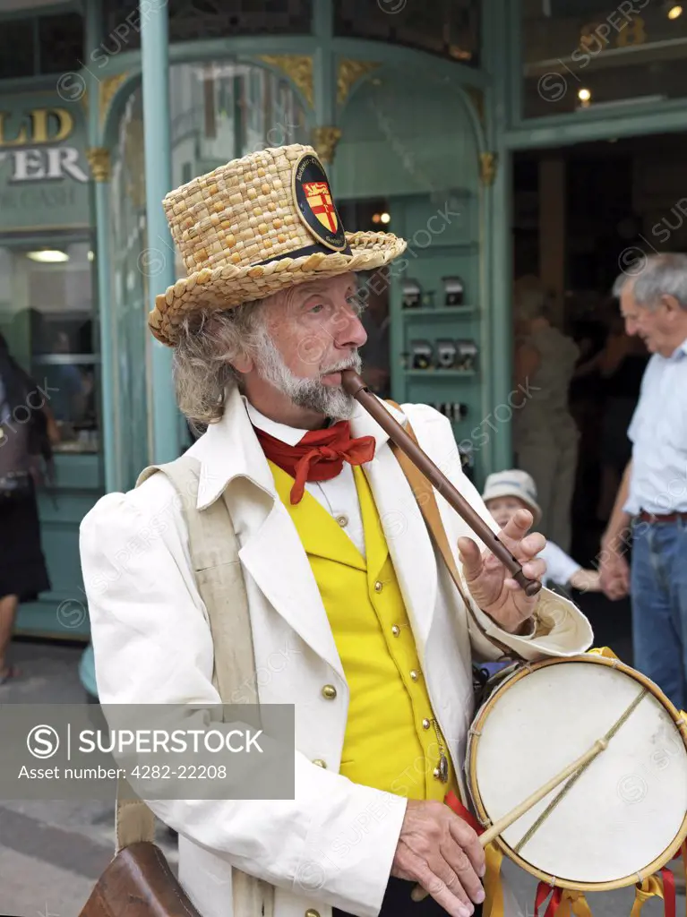 England, Kent, Rochester. An entertainer dressed in Victorian costume performing at the Dickens Festival in Rochester.