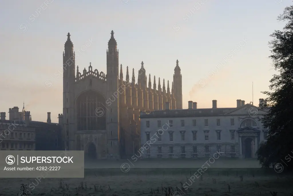 England, Cambridgeshire, Cambridge. Kings College Chapel at sunrise in Autumn. It is one of the most iconic buildings in the world, and is a splendid example of late Gothic (Perpendicular) architecture.