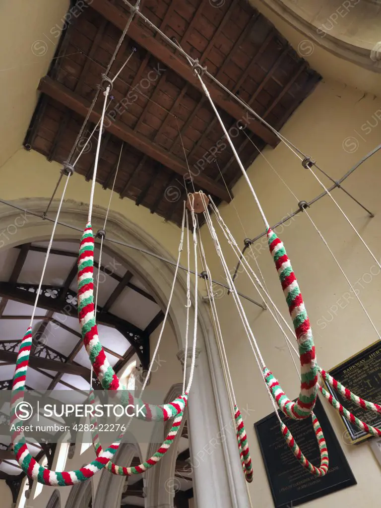 England, Hertfordshire, Barkway. Ropes from a peal of eight bells in the tower of St. Mary Magdalene Church in Barkway.