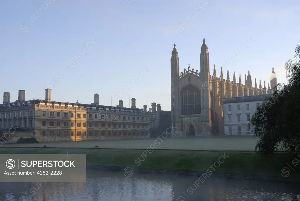 England, Cambridgeshire, Cambridge. Kings College Chapel at sunrise in Autumn. It is one of the most iconic buildings in the world, and is a splendid example of late Gothic (Perpendicular) architecture.