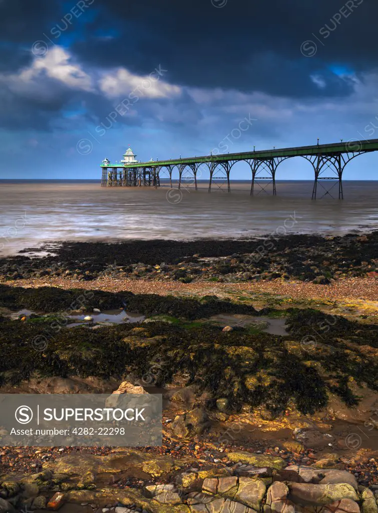 England, Somerset, Clevedon. Clevedon Beach and Pier in the Severn Estuary at Sunrise.