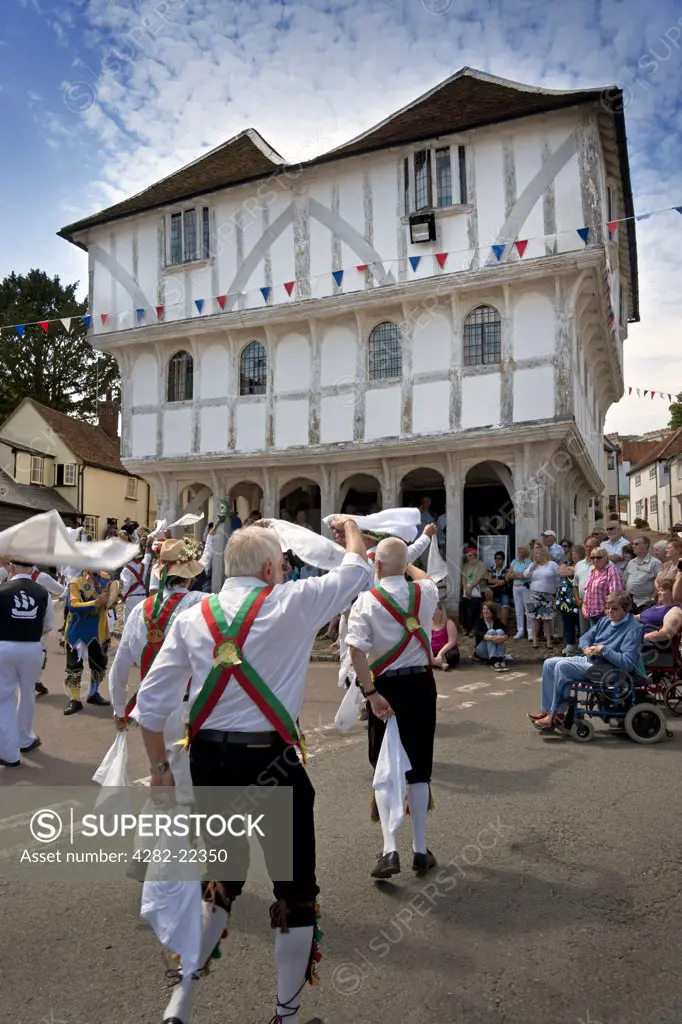 England, Essex, Thaxted. Morris Dancing at the Centenary Morris Dancing Festival in front of the ancient Guildhall in Thaxted. 2011 is the centenary of the founding in December 1911 of the English Folk Dance Society by Cecil Sharp and the Thaxted Morris and Folk Song Company by Miriam Noel eleven months earlier in January 1911.