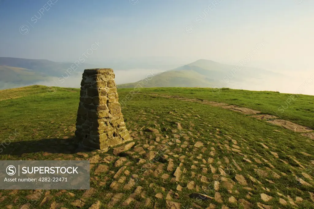 England, Derbyshire, Peak District. A misty morning at the Mam Tor trig point in Derbyshire.