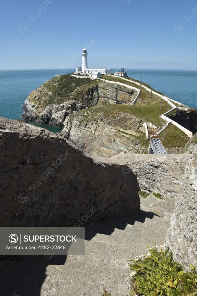 Wales, Anglesey, South Stack. Stone steps down to the suspension bridge that connects South Stack Lighthouse to the mainland of the Isle of Anglesey.