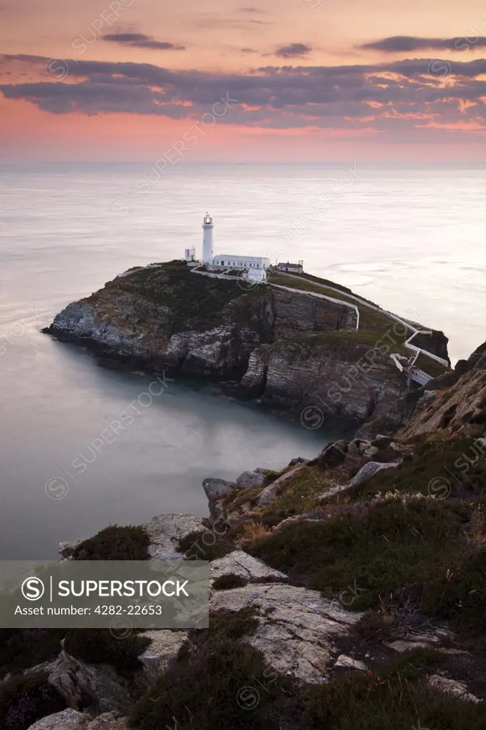 Wales, Anglesey, South Stack. South Stack Lighthouse, a spectacular lighthouse just off Holy Island on the north west coast of Anglesey at sunset.
